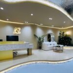 Reception lounge with logo and seating area, AE Browart Award-Winning Eyebrow Embroidery Specialist, Petaling