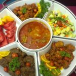 Round platter with curry, meats, salad, and fruit, Along Catering, Johor Bharu
