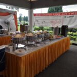 Buffet chafing dishes set up outdoors at event, Along Catering, Johor Bharu