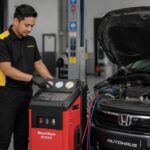 Mechanic servicing car air conditioning with diagnostic machine, Autohaus KL, Seri Kembangan