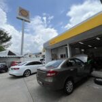 Cars parked outside a service station workshop bay, Autohaus KL, Seri Kembangan