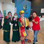 Staff posed with a clown at showroom counter, Az World - Ptt Car Care Service Centre, Seri Kembangan