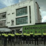 Staff lined up in front of building and delivery truck, Bateriku.com Pitstop Pulau Tikus, Georgetown