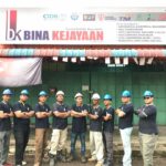 Team in helmets posed outside shop signboard, Bina Kejayaan, Tebrau