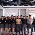 Staff group photo posing in showroom lobby, Carride luxury interion, Seri Kembangan