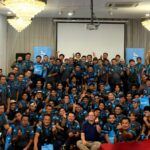 Large group of staff posing together in a hall, Casper Electric, Kuala Lumpur