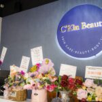 Reception counter with lit signboard and flower bouquets, Ckin Beauty Malaysia, Johor Bahru