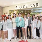 Staff group photo posed outside shop entrance with sign, Face Bar, Petaling Jaya