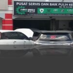 Car workshop shopfront with signboard and parked cars outside, First Angle Auto, Batu Caves