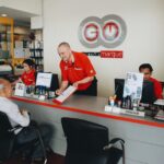 Staff assisting customer at service counter, German Marque, Shah Alam