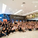 Large group photo posing inside a shopping mall, Hairstory International, George Town