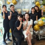 Staff team posing at anniversary celebration with balloons, Holistic Hair Care, Puchong
