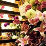 Floral congratulatory bouquet display at storefront entrance, iBeauty Salon and Academy, Tanjong Tokong