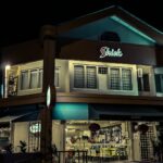 Night view of a corner shophouse building with signboard, Kafe Shiok Kopitiam, Tiada Maklumat Daerah
