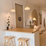 Minimalist beige waiting area with counter and stools, Mercy Brow Art Beauty Aesthetics Center, Puchong
