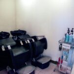 Salon shampoo chairs with hair product bottles displayed, Miko Galere, Puchong