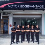 Staff posed outside a car workshop entrance, Motor Edgevantage, Subang Jaya