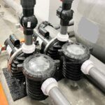 Pool pumps and filtration pipes installed in plant room, NEZOD Pools Products, Batu