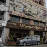 Restaurant shopfront with signboard and parked cars, Nyonya Kitchen & Caterers Sdn Bhd, Klang
