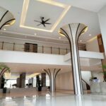 Spacious hotel lobby with decorative columns and ceiling fan, Pacific Regency Beach Resort Port Dickson, Port Dickson