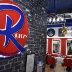 Salon interior with styling chairs and mirrors, logo on wall, Ritzy RS, Subang Jaya