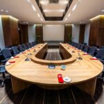 Empty conference room with U-shaped table and chairs, Sabah International Convention Centre, Kota Kinabalu