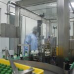 Factory worker operating bottle filling machine line, Sireh Emas Marketing Sdn.Bhd, Shah Alam