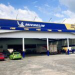 Tyre service shopfront with signage and parked vehicles, Swee Hing Tyres, Johor Bahru