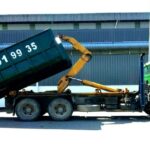 A garbage truck lifting a skip bin with phone number, Viva Charian Enterprise M Sdn Bhd, Ampang
