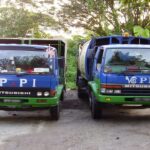 Two blue trucks parked outdoors near trees, Viva Charian Enterprise M Sdn Bhd, Ampang