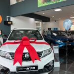 New car with ribbon in showroom, World Car Care Services Sdn. Bhd, Seri Kembangan