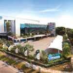 Aerial view of a large automotive centre building, YHI POWER Malaysia, Petaling